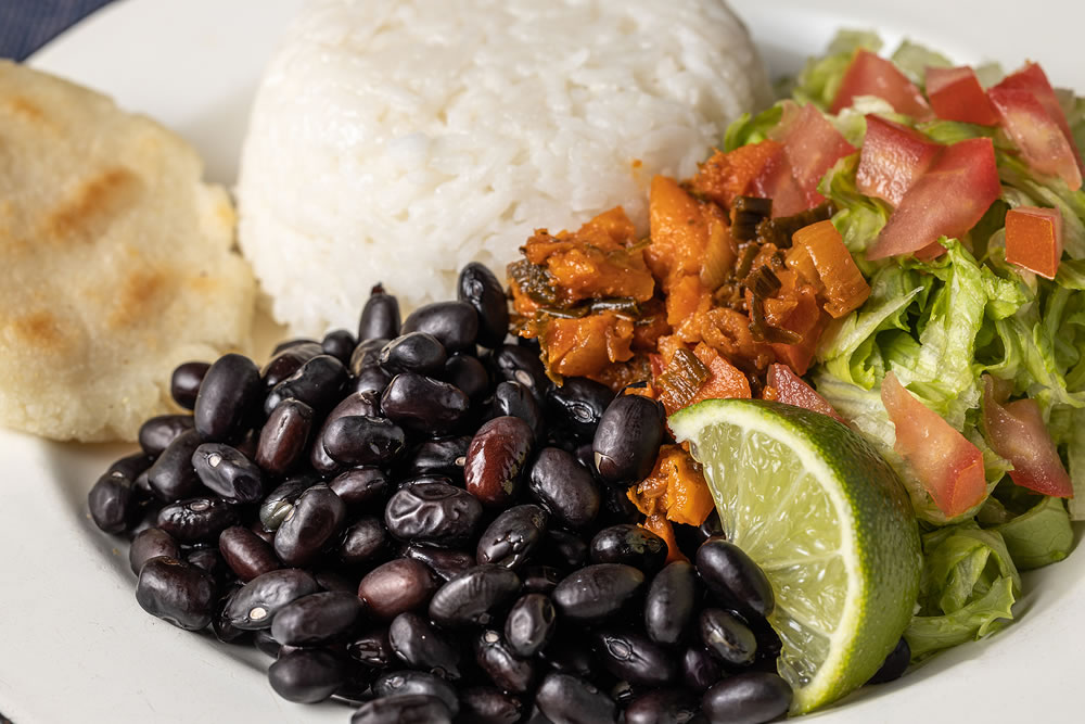 Extreme close up of Casado, typical Costa Rican dish with rice, beans and vegetables.