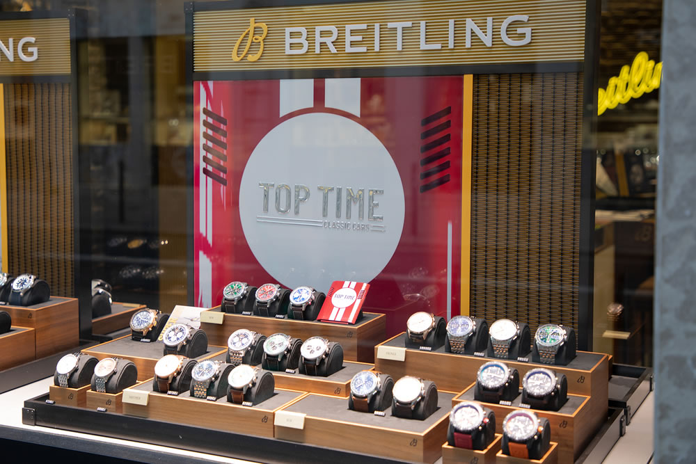 Breitling top time classic cars logo brand facade and text sign swiss watches display shop jewelry store wall boutique