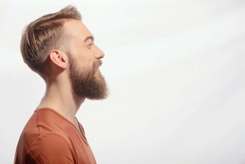 Side view portrait of handsome bearded man