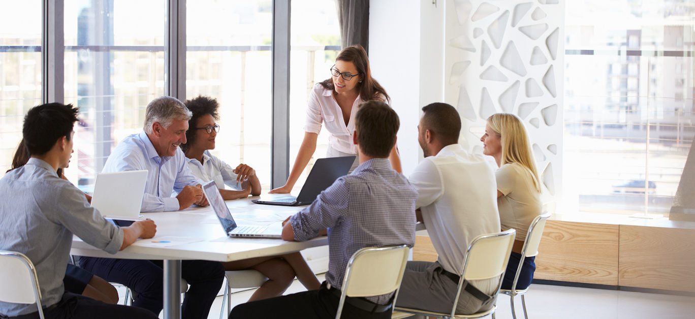 Businesswoman presenting to colleagues at a meeting