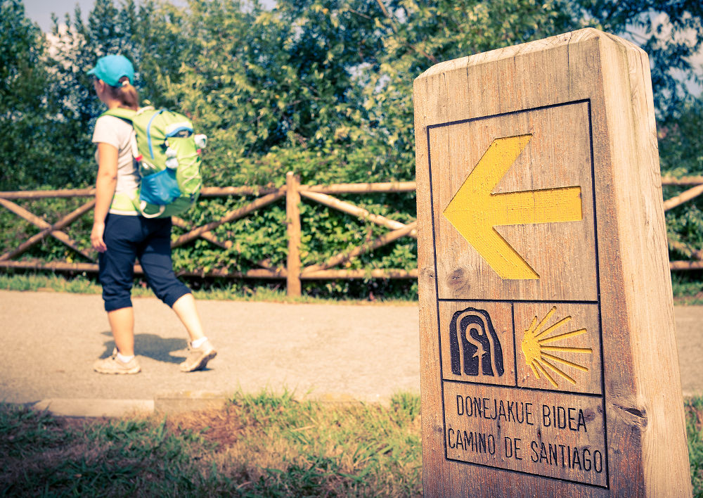 pilgrim walking along the Camino de Santiago