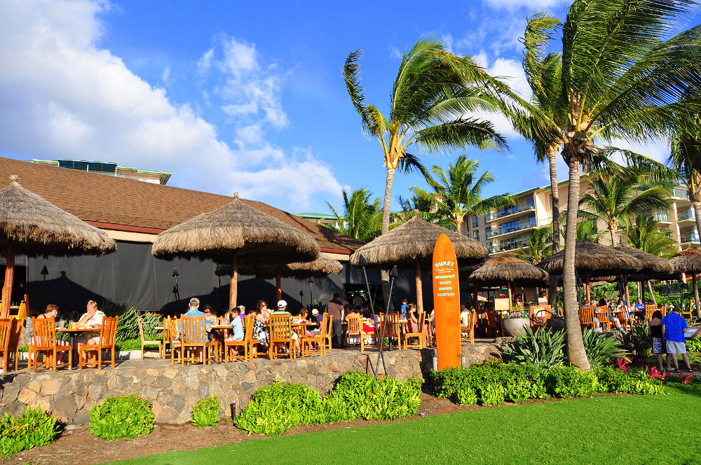 tourists on the patio of the famous Duke's Restaurant 