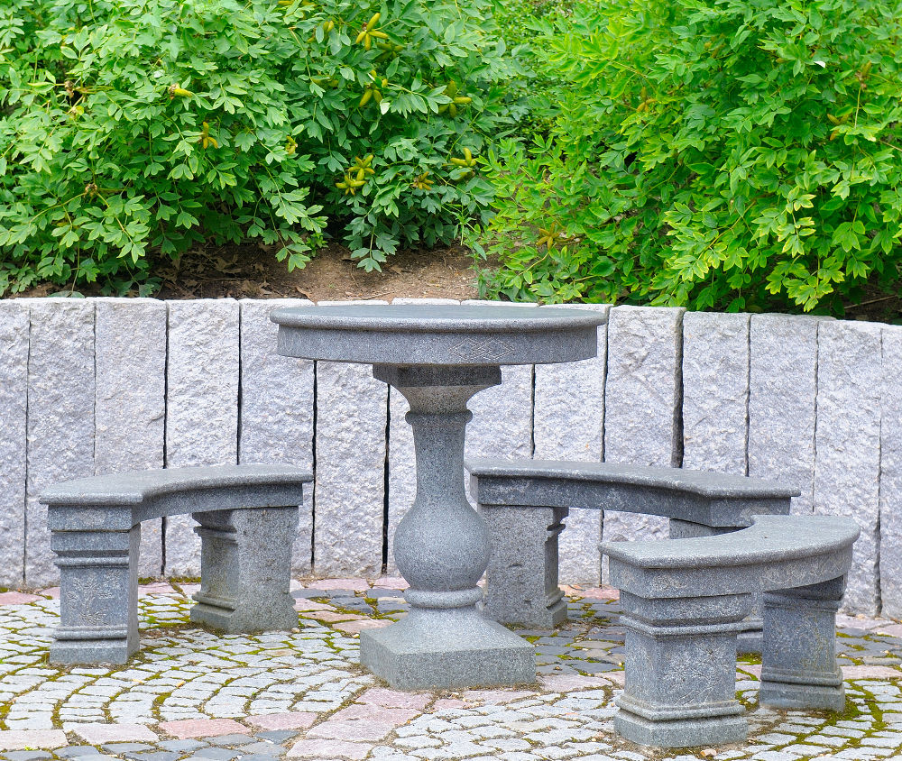 Garden furniture (table and benches) made of granite and marble.