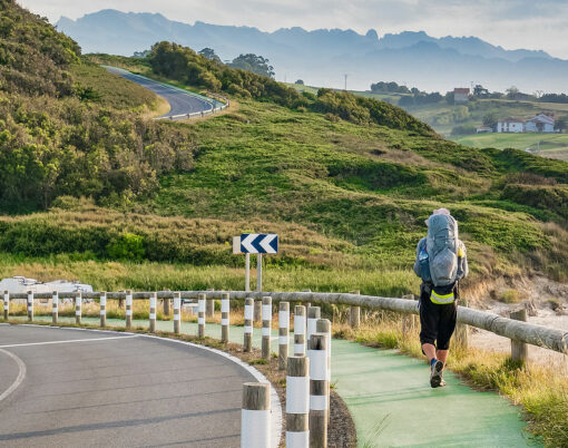 Lonely Pilgrim with backpack walking the Camino de Santiago in Spain, Way of St James