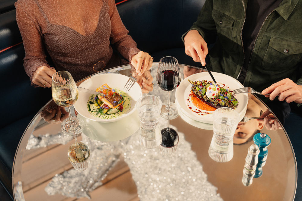 couple enjoying food at Brasserie of Light