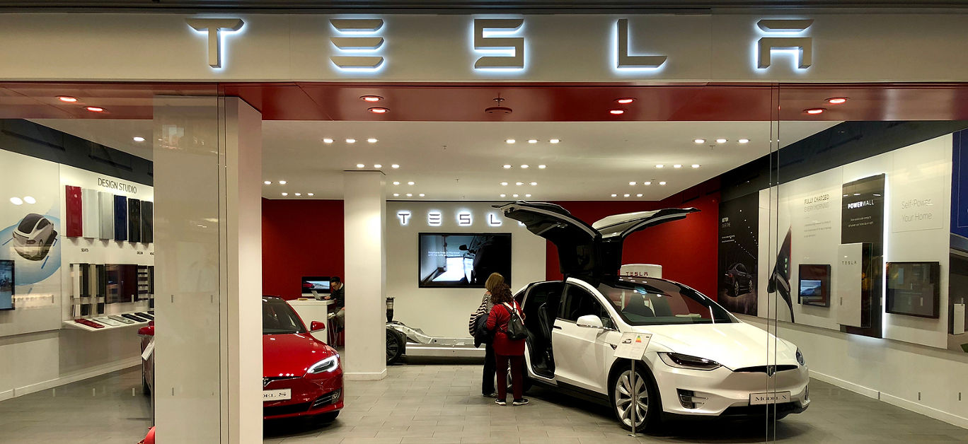 Model S and Roadster vehicles on display inside a Tesla Motors Store at Brent Cross Shopping Centre in Barnet, North London, England, UK.