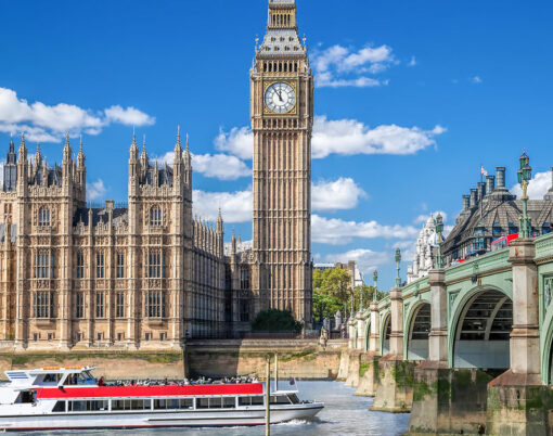Big Ben and Houses of Parliament with boat in London England UK