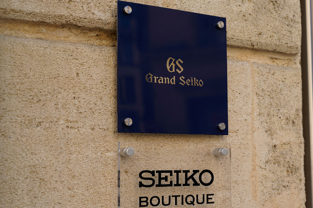 Seiko grand boutique sign text and brand logo of japanese holding shop company manufacturing selling watches store