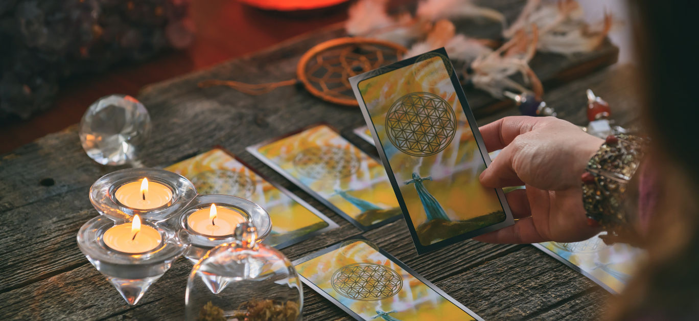 Woman holds tarot cards in her hands. Concept of psychic advisor or ways of divination