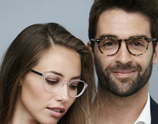 Beautiful couple wearing fashionable eye glasses portrait