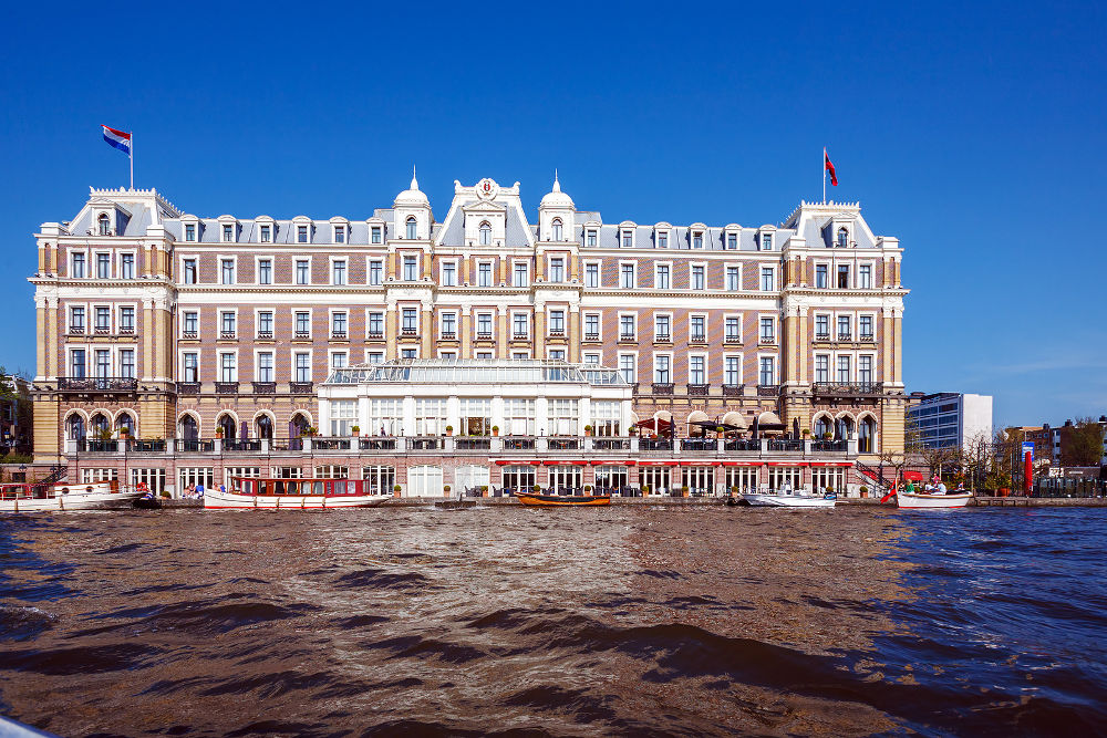 Building of Amstel Hotel from Canal Amsterdam Netherlands