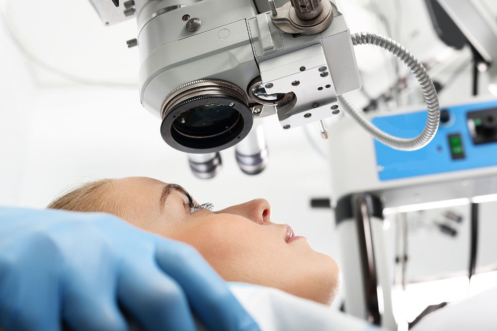 Eye doctor during the treatment of vision refractive surgery