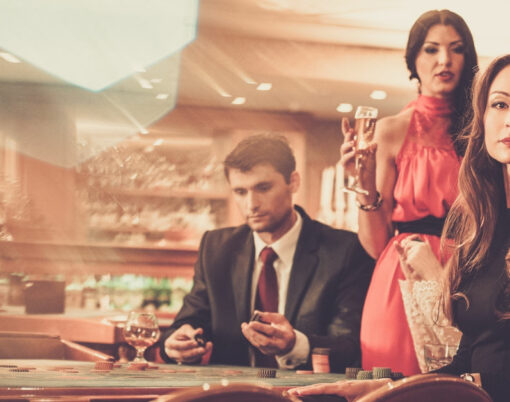 Group of stylish people playing in a casino