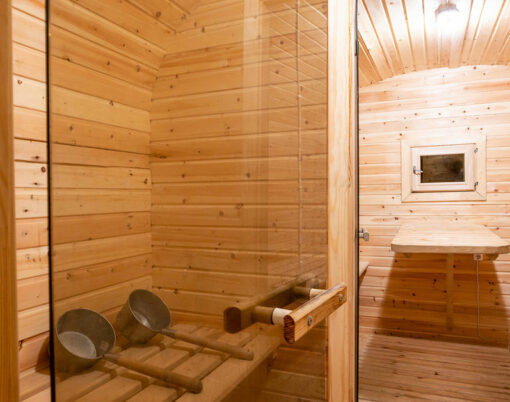 interior. rural mobile wooden sauna in the form of a barrel in a pine forest .