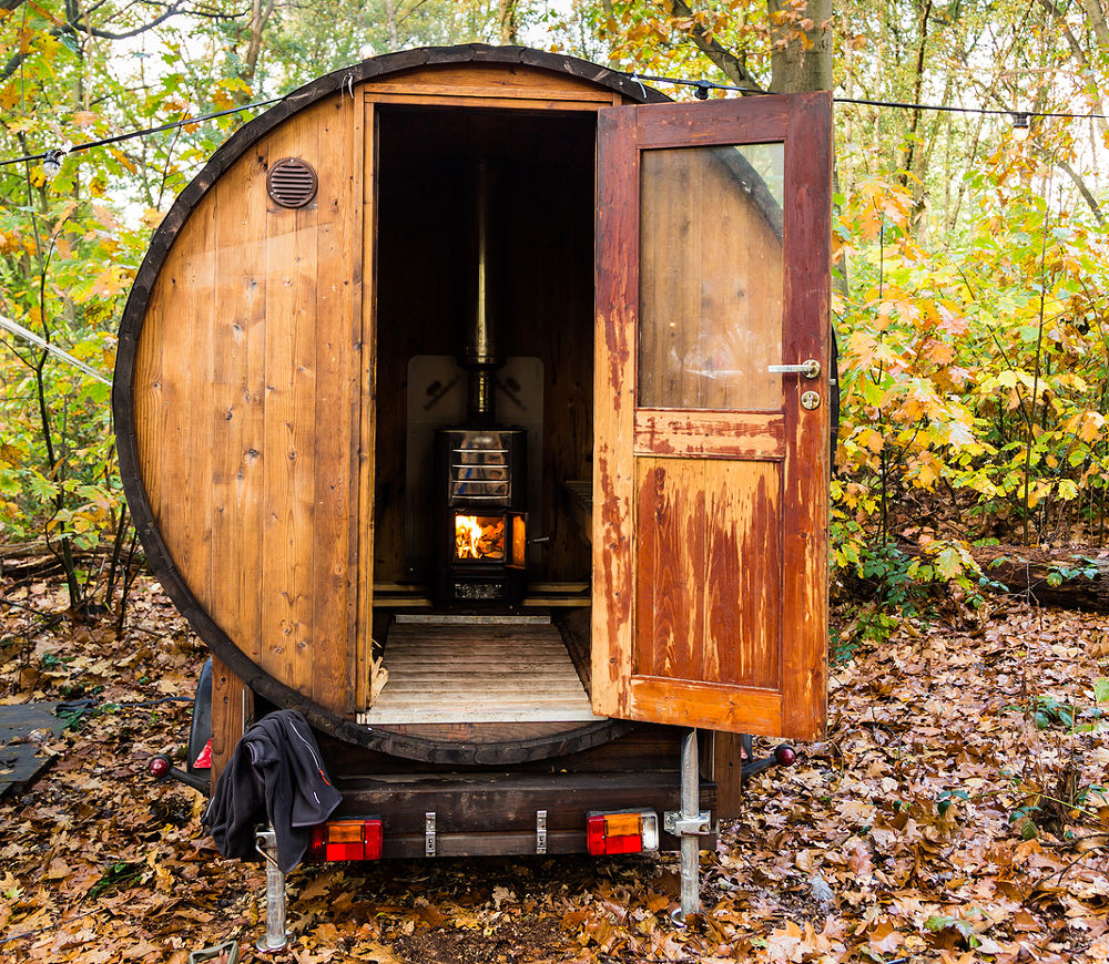 Outdoor wooden and transportable little sauna in an old wine barrel