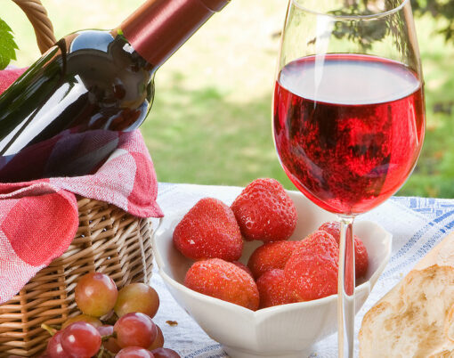 Romantic picnic setting with wine bread and cheese