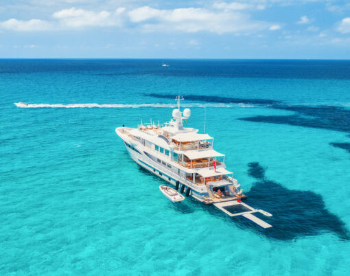 Yacht On The Azure Seashore In Balearic Islands. Aerial View Of