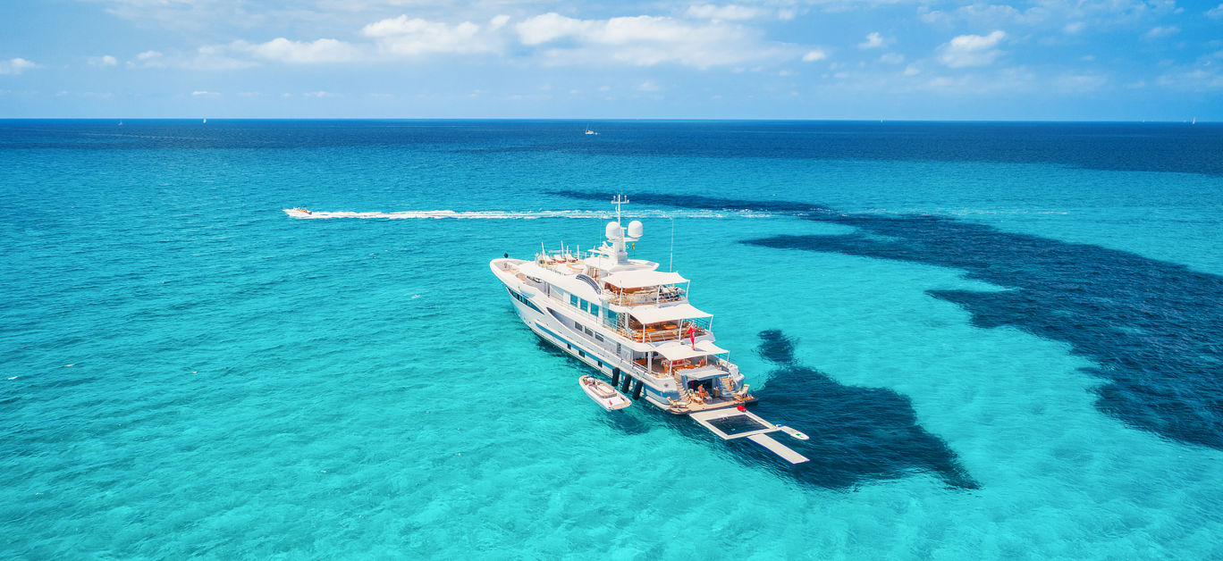 Yacht On The Azure Seashore In Balearic Islands. Aerial View Of