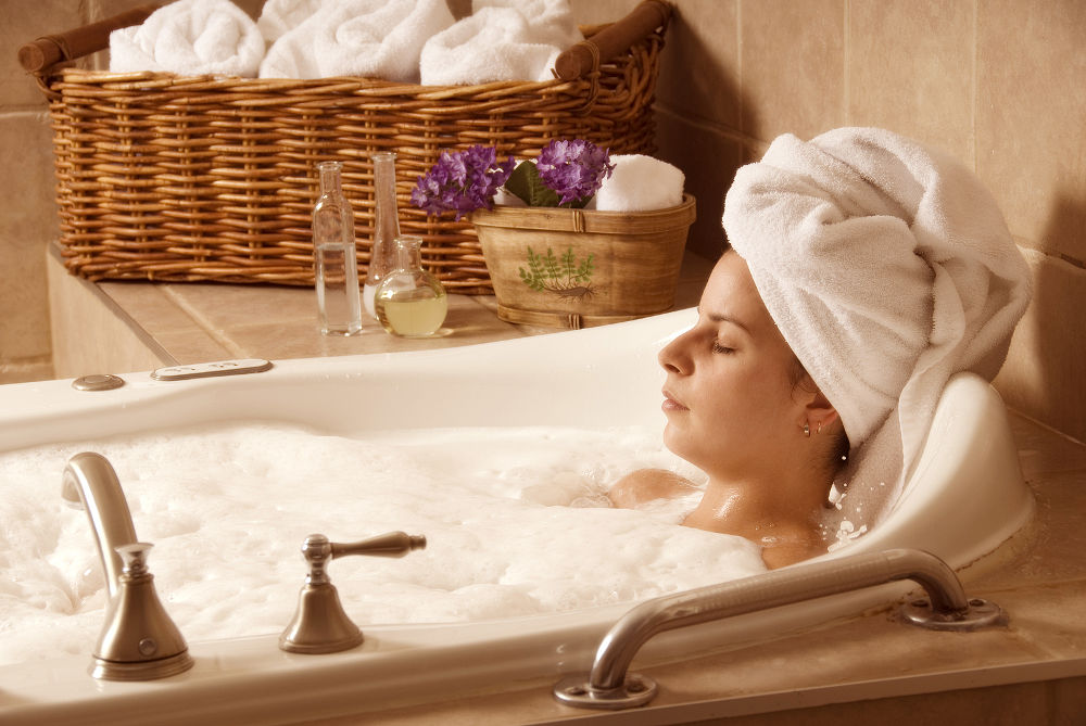 cute girl with a towel on her head in a bath