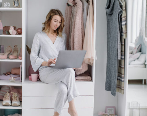 Young woman chooses things online from the comfort of your dressing room. Online shopping