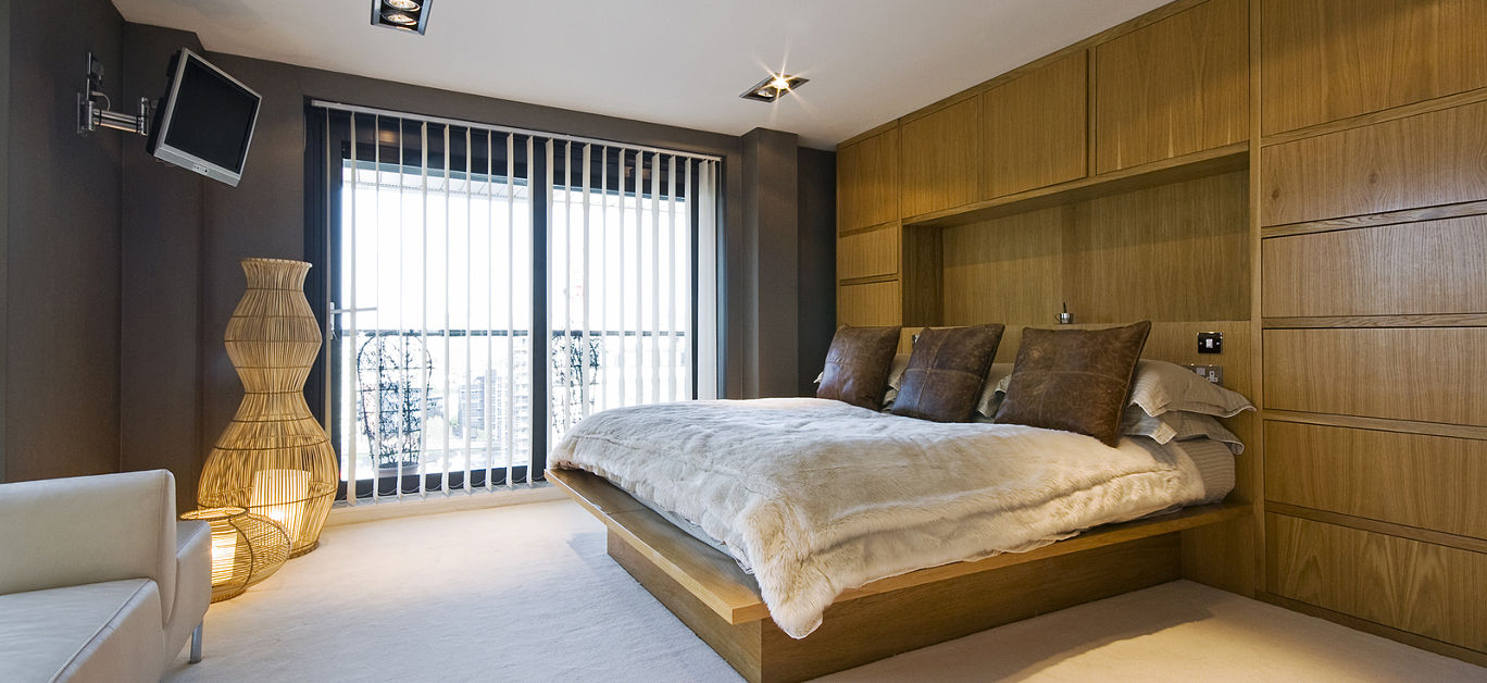 stunning luxury bedroom with a king size bed, wall mount plasma tv, sofa ...