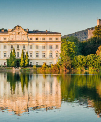 Famous Schloss Leopoldskron, location to Karl Lagerfeld's Paris-Salzburg catwalk presentation show to showcase the new Chanel Métiers d'Art 2014/15 fashion collection, in Salzburg, Austria at sunset