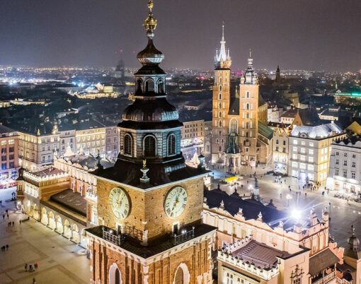 Aerial drone view Cracow old town and city main square at night. Cracow, Lesser Poland