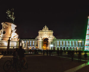 Christmas tree on Commerce square at night in Lisbon, Portugal