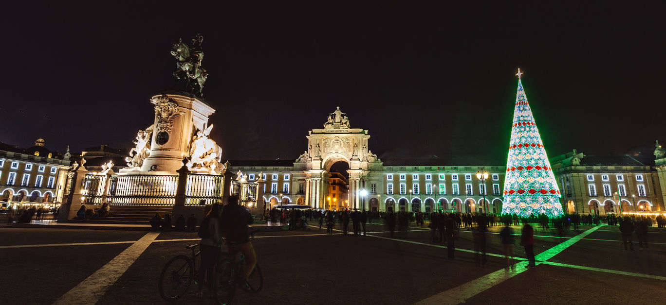 Christmas tree on Commerce square at night in Lisbon, Portugal