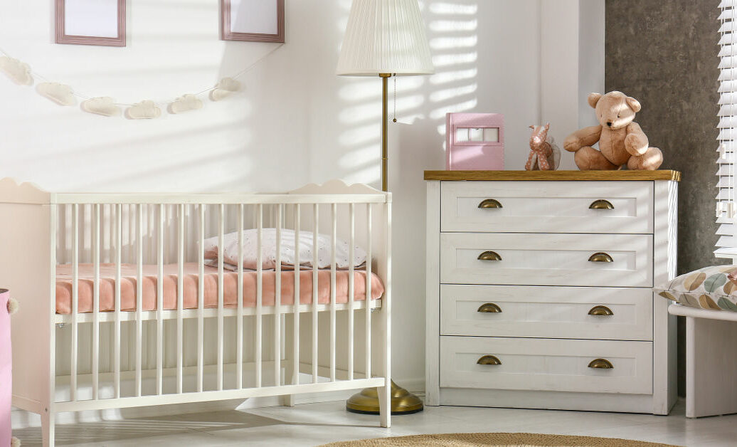 Cozy baby room interior with comfortable crib