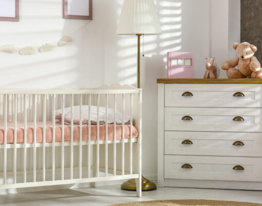 Cozy baby room interior with comfortable crib