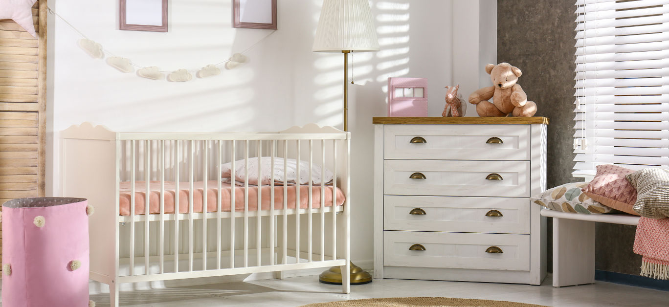 Cozy baby room interior with comfortable crib