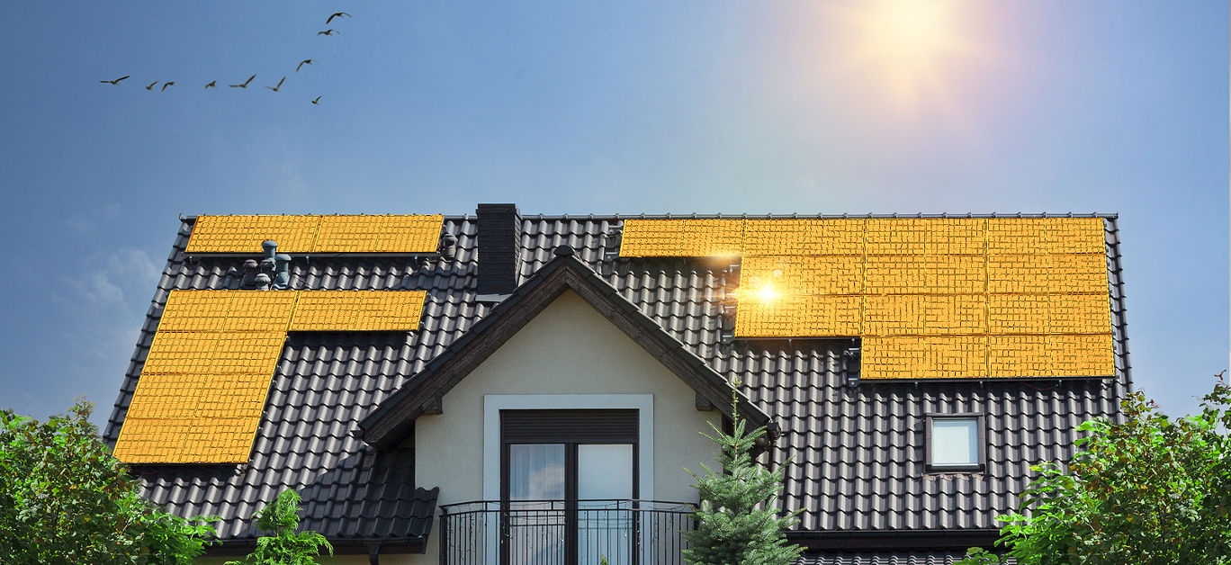 Golden solar panels on roof of beautiful modern house. Concept of saving money