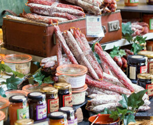 Great selection of___ salami and jam. Photo taken in a street market Borough Market in London.