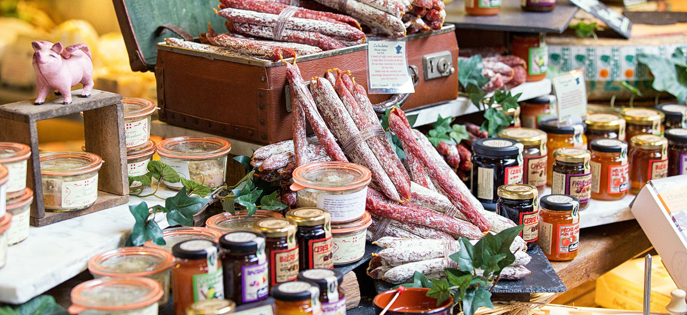 Great selection of___ salami and jam. Photo taken in a street market Borough Market in London.