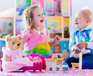 Kids playing with doll house and stuffed animal toys