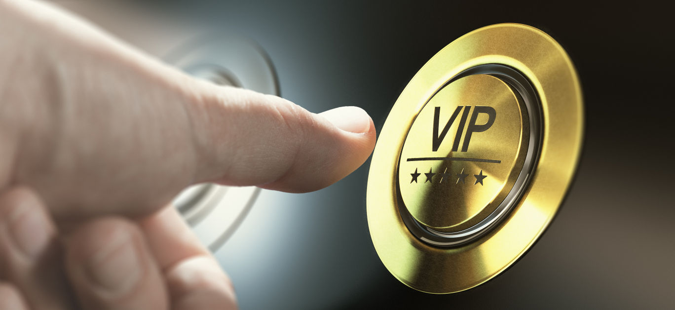 Man with private access to VIP services pressing a button to ask a concierge