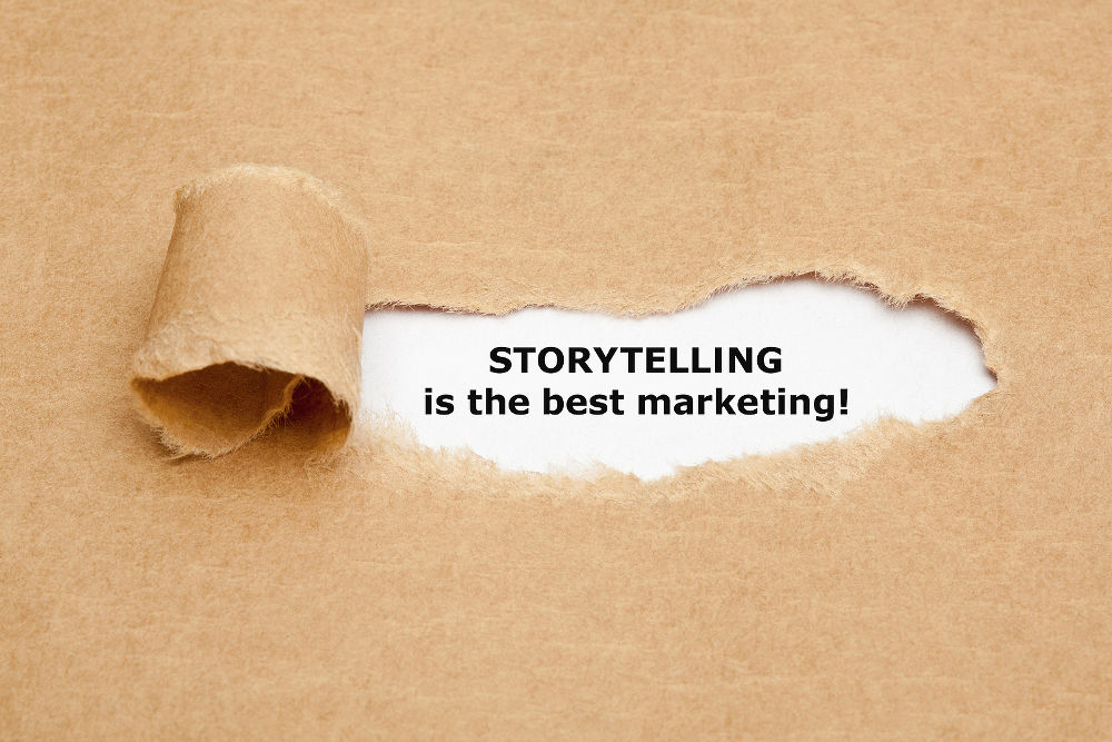 The motivational quote Storytelling is the best Marketing appearing behind torn brown paper.