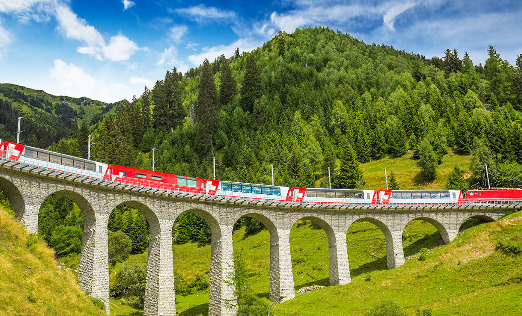 Train on famous landwasser Viaduct bridge.The Rhaetian Railway section from the Albula/Bernina area (the part from Thusis to Tirano including St Moritz) was added to the list of UNESCO World Heritage Sites Switzerland Europe.