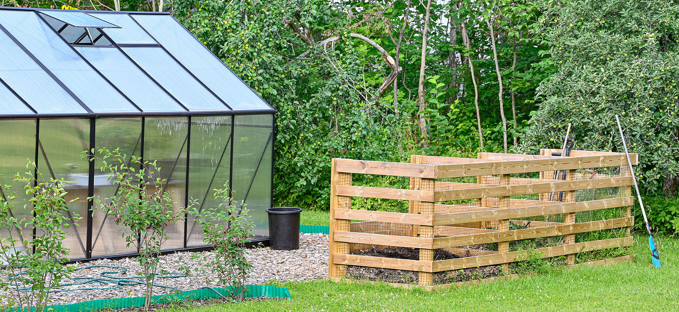 big garden compost and green house in garden