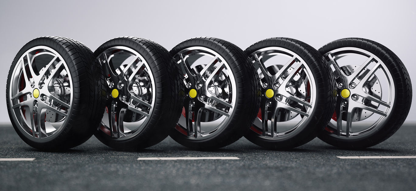 Car wheel, car tire standing on a road