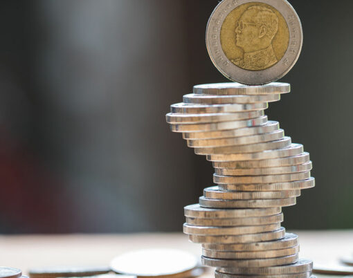 Close up of coins to stack of coins, Business Growth concept, There is money coins to stack of coins. Financial risk.