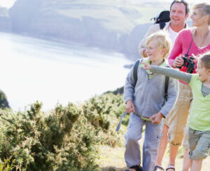 Families on coastal walk across cliffs