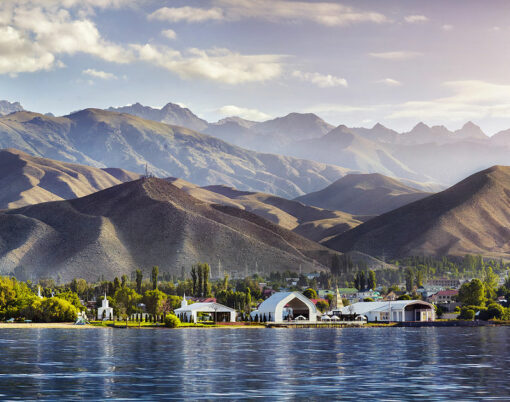 View to Ruh Ordo cultural complex near Issyk Kul lake at mountains background in Cholpon Ata Kyrgyzstan