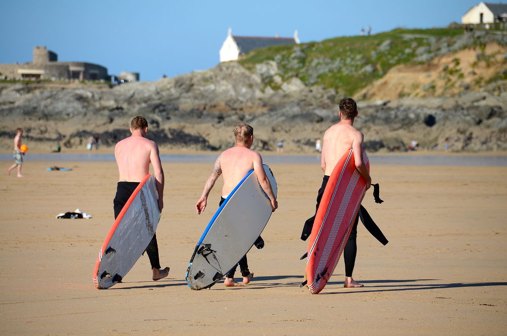 Surfers at Fistral Beach, Newquay in Cornwall