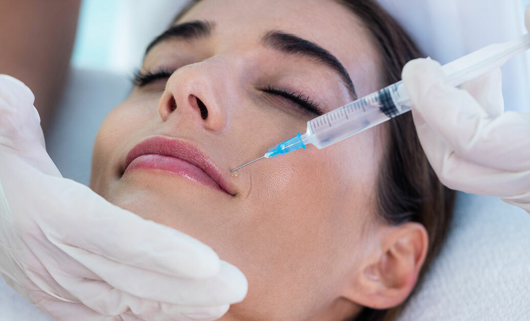 Woman receiving botox injection at spa