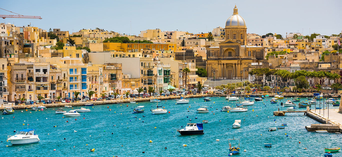 many little yachts and boats from plan wiev to the bay near Valletta in Malta