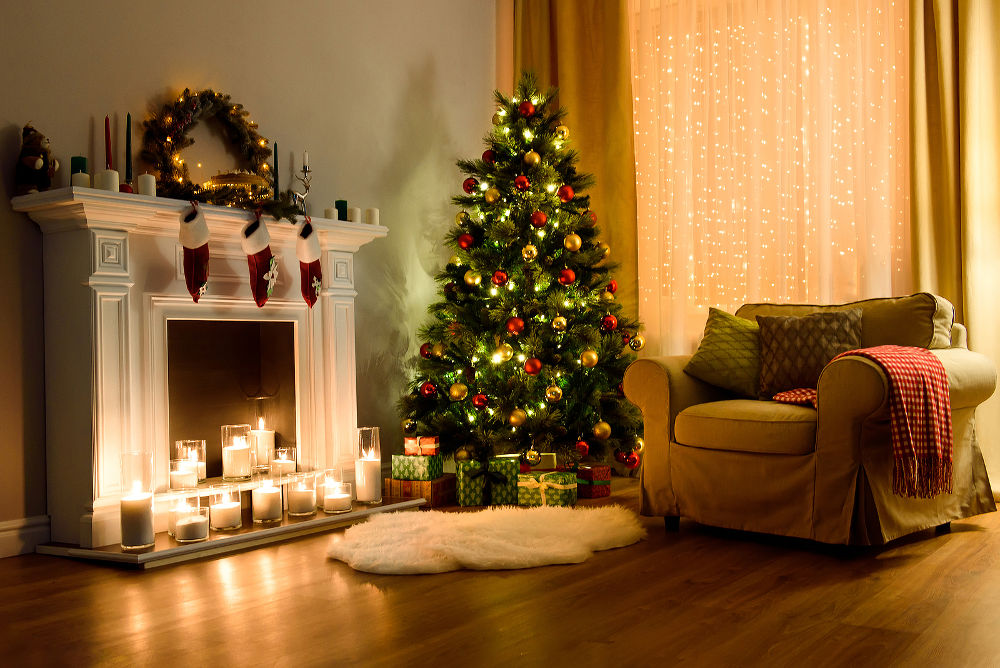 A cozy living room lighted with numerous lights decorated ready to celebrate Christmas