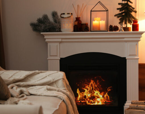 Fireplace in room with Christmas decorations. Interior design