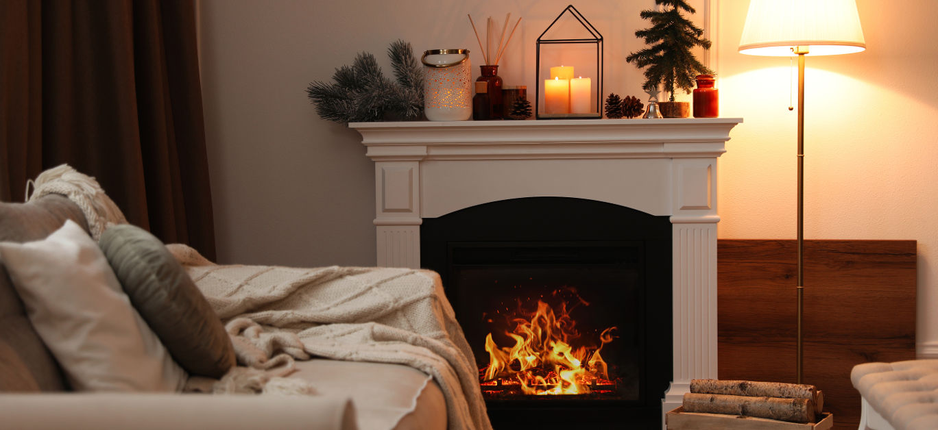 Fireplace in room with Christmas decorations. Interior design